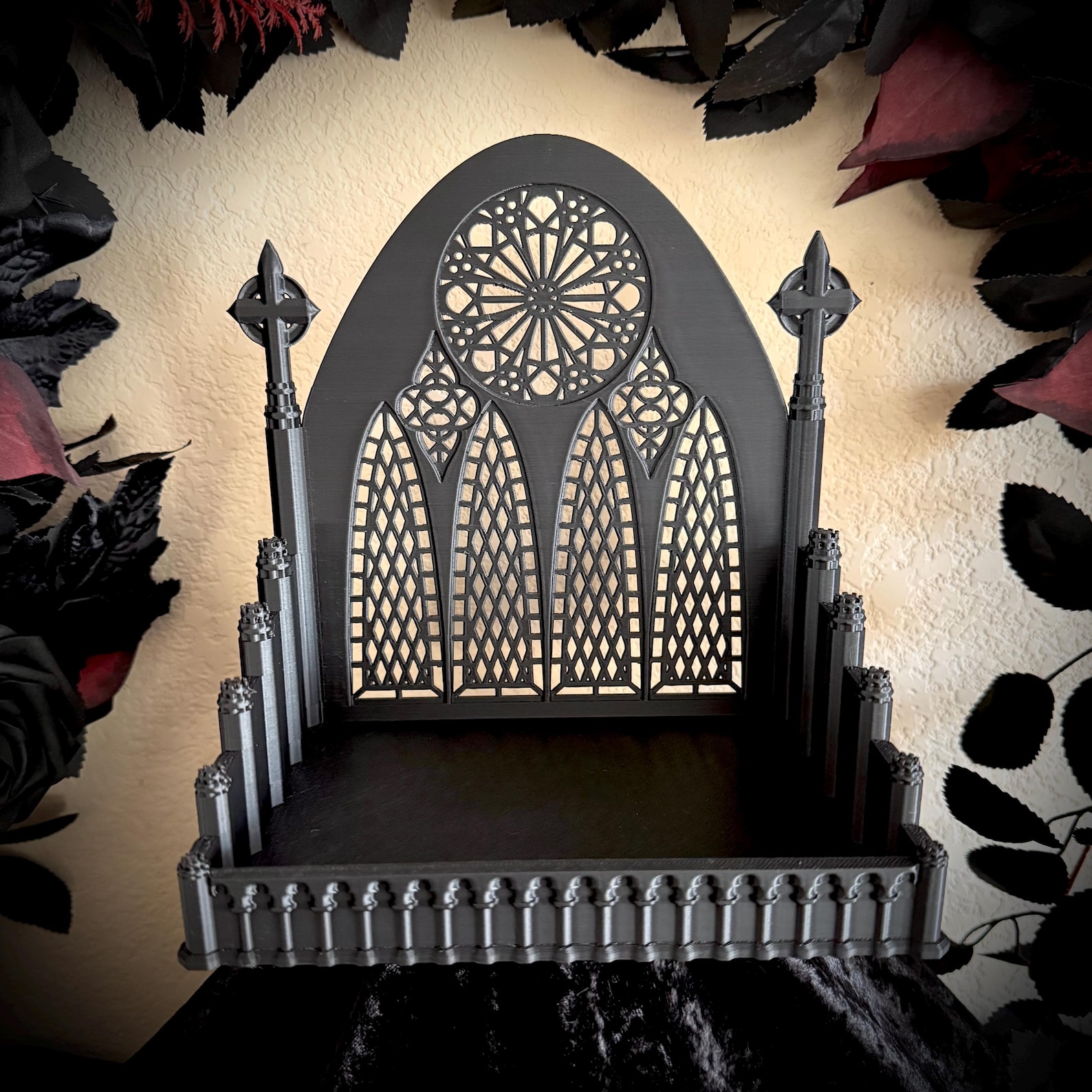 Miniature black accessory tray with cathedral-like spires and rose window detail