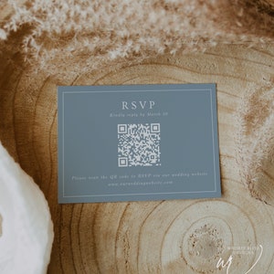 May include: A blue RSVP card with a white QR code and the text "RSVP" and "Kindly reply by March 20". The card also includes the text "Please scan the QR code to RSVP via our wedding website www.ourweddingwebsite.com".