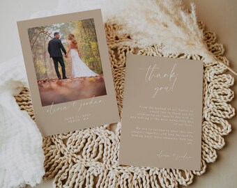 May include: A thank you card with a beige background and white text. The text reads "Thank you!" and "From the bottom of our hearts we would like to thank you for celebrating our special day with us and making it the most memorable day of our lives." The card also includes the couple's names, "Olivia & Jordan", and the date and location of their wedding, "June 17, 2023, Perth, WA". The card is decorated with a simple, handwritten font.