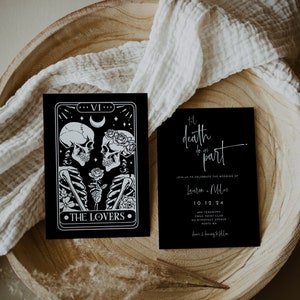May include: Black and white wedding invitation with a tarot card design featuring skeletons holding a rose. The text reads "Til death do us part" and includes the couple's names, wedding date, and location.
