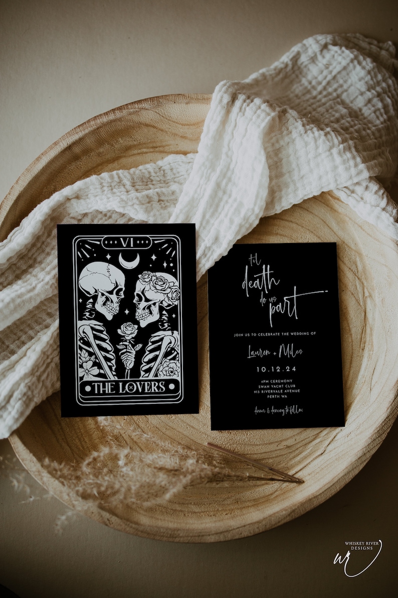 May include: Black and white wedding invitation with a tarot card design featuring skeletons holding a rose. The text reads "Til death do us part" and includes the couple's names, wedding date, and location.