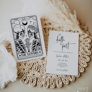 May include: Two wedding invitation cards. One card features a black and white illustration of skeletons and the text "THE LOVERS." The other card has the text "til death do us part" and wedding details.