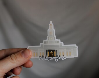May include: White sticker of a church building with a tall steeple and the text "Tallahassee, Florida" underneath.