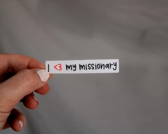May include: White sticker with the text "I <3 my missionary" written in black marker.