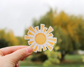 May include: A yellow sun sticker with the text "Look unto Christ -  He is the Light" in a circle.
