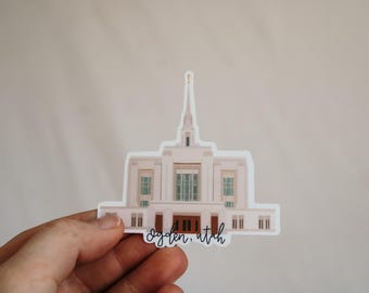 May include: A white sticker with an illustration of a white temple with a tall spire. The text "Ogden, Utah" is written below the temple.