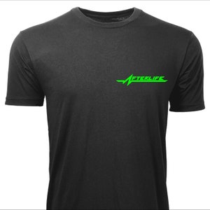 May include: Black crew neck t-shirt with short sleeves. The shirt features the word "AFTERLIFE" in bright green, with a stylized heartbeat line design above the text. The shirt is made of a soft, dark material.