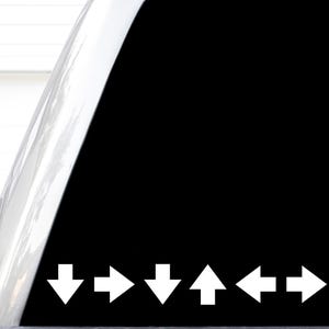May include: A black vinyl decal featuring a sequence of six white directional arrows. The pattern consists of a downward arrow, a rightward arrow, a downward arrow, an upward arrow, a leftward arrow, and a rightward arrow arranged in a horizontal line.