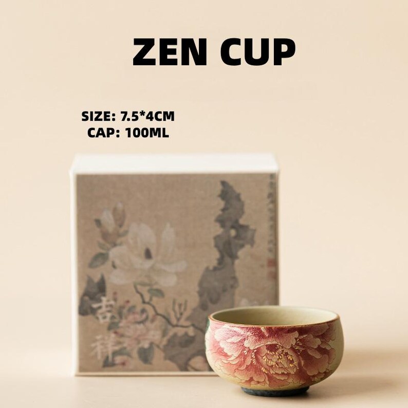 May include: A small, round ceramic Zen cup with a floral design in shades of red and pink. The cup is displayed in front of a box with floral artwork. The text "ZEN CUP" and size information are visible.