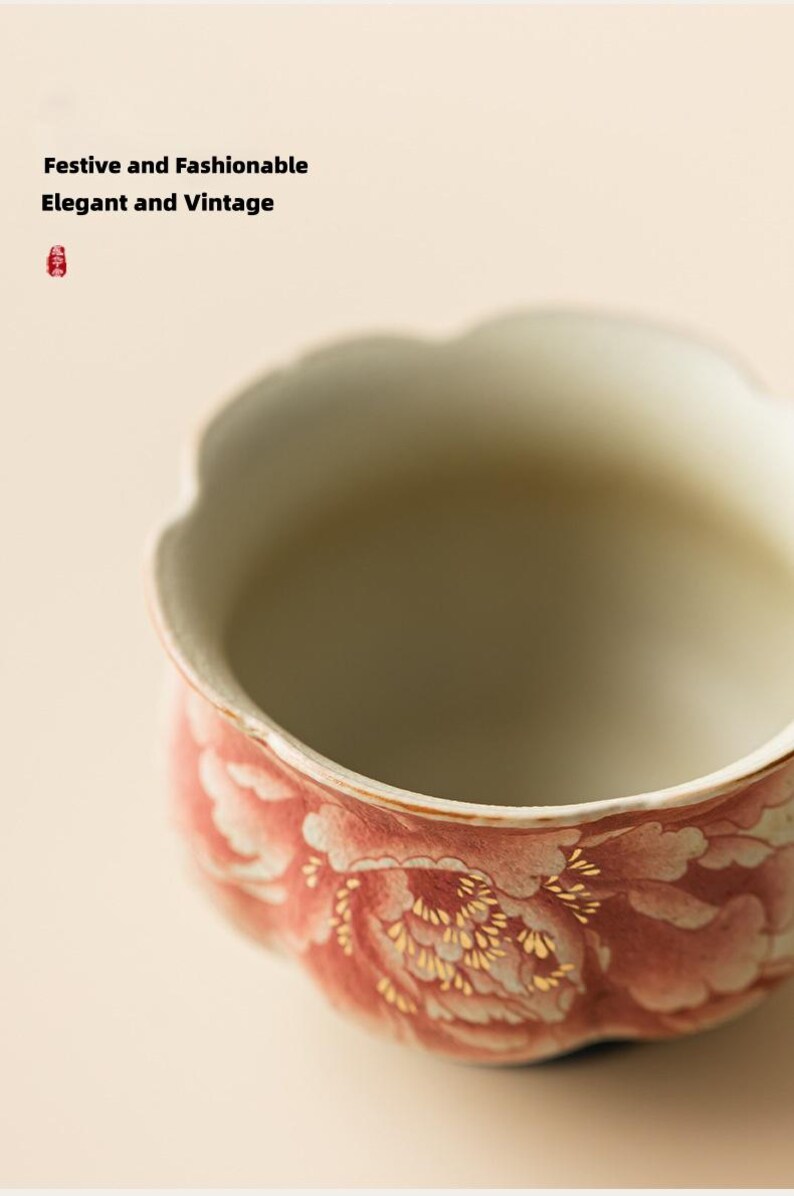 May include: A ceramic bowl with a scalloped rim, featuring a floral design in shades of red and white with gold accents. The text "Festive and Fashionable, Elegant and Vintage" is visible in the background.