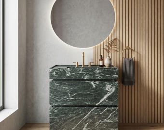 Mueble de baño a medida de mármol Verde Alpi, con lavabo de piedra natural verde oscuro.