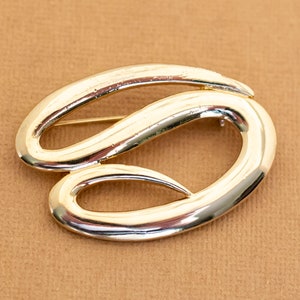 Broche vintage abstrato com ondas deslizantes em tom dourado - Y12