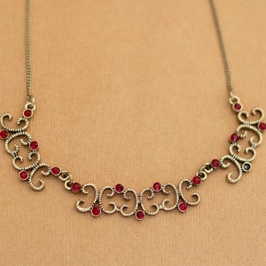 Vintage Gold Tone Curves Red Rhinestones Bib Necklace 18 inch by Avon - Y8