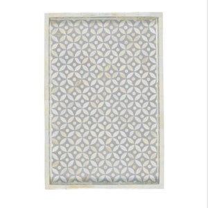 May include: A white rectangular tray with a raised border and a gray and white geometric pattern.