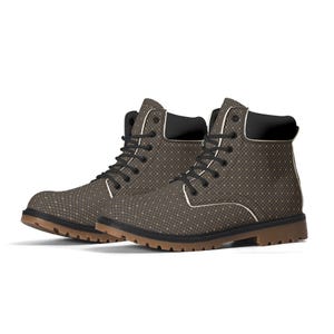 May include: A pair of brown and black patterned ankle boots with white laces. The boots have a black rubber sole.
