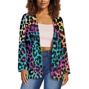 May include: A vibrant, open-front blazer featuring a colorful leopard print design. The jacket showcases a spectrum of colors, including pink, blue, yellow, and black, creating a bold and eye-catching look. The blazer has a classic lapel and two front pockets.
