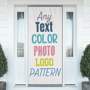 May include: A white door banner with the words "Any Text COLOR PHOTO LOGO PATTERN" in various colors. The banner is hanging on a white door with sidelights and greenery on either side.