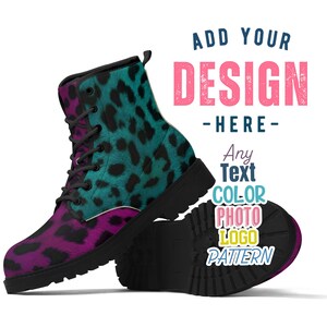 May include: A pair of black leather boots with a teal and pink leopard print design. The boots have a lace-up closure and a chunky sole. The text "ADD YOUR DESIGN - HERE - Any Text COLOR PHOTO LOGO PATTERN" is printed on the side of the boots.