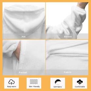 May include: A white hooded blanket with a pocket, sleeves, and a hat. The blanket is soft, comfortable, and skin-friendly. It is also warm and perfect for snuggling up on the couch.