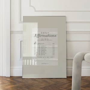 K&ouml;nnte beinhalten: Ein grau-wei&szlig;es Poster mit dem Text "T&auml;gliche Affirmationen" und einer Liste von Affirmationen, wie "Ich bin geliebt", "Ich bin kreativ" und "Ich bin m&auml;chtig".