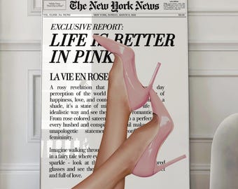 May include: A framed print featuring the headline "LIFE IS BETTER IN PINK" from The New York News. The image shows a pair of legs wearing pink high heels. The print has a white background and is displayed in a room.