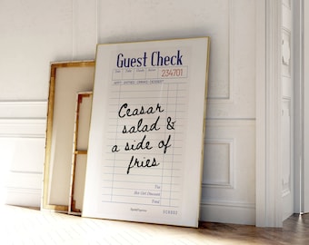 Puede incluir: Un cheque de restaurante blanco con texto negro que dice "Guest Check" y "234701". El texto "Ceasar salad & a side of fries" está escrito en cursiva negra.