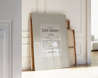 May include: A framed print with a gold frame and a white background. The print features a list of ingredients for a "Classic Girl Dinner" with the text "Bon Appetit" at the bottom.