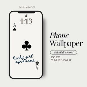May include: A black and white phone wallpaper with a black clover design and the text "lucky girl syndrome". The time is 4:13. The wallpaper is for a 2023 calendar.