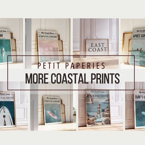May include: Collection of framed coastal prints with newspaper-style headlines, including "APR&Egrave;S SURF" and "SURF'S UP, COWGIRL." The prints feature beach scenes and the text "EAST COAST." The words "PETIT PAPERIES" and "MORE COASTAL PRINTS" are also visible.