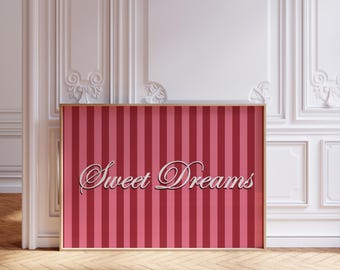 May include: A framed print with a pink and white striped background and the text "Sweet Dreams" in white.