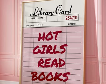 May include: A framed print featuring a pink library card design with the words "HOT GIRLS READ BOOKS" in bold, red letters. The top of the card reads "Library Card" and includes fields for date, name, and author.