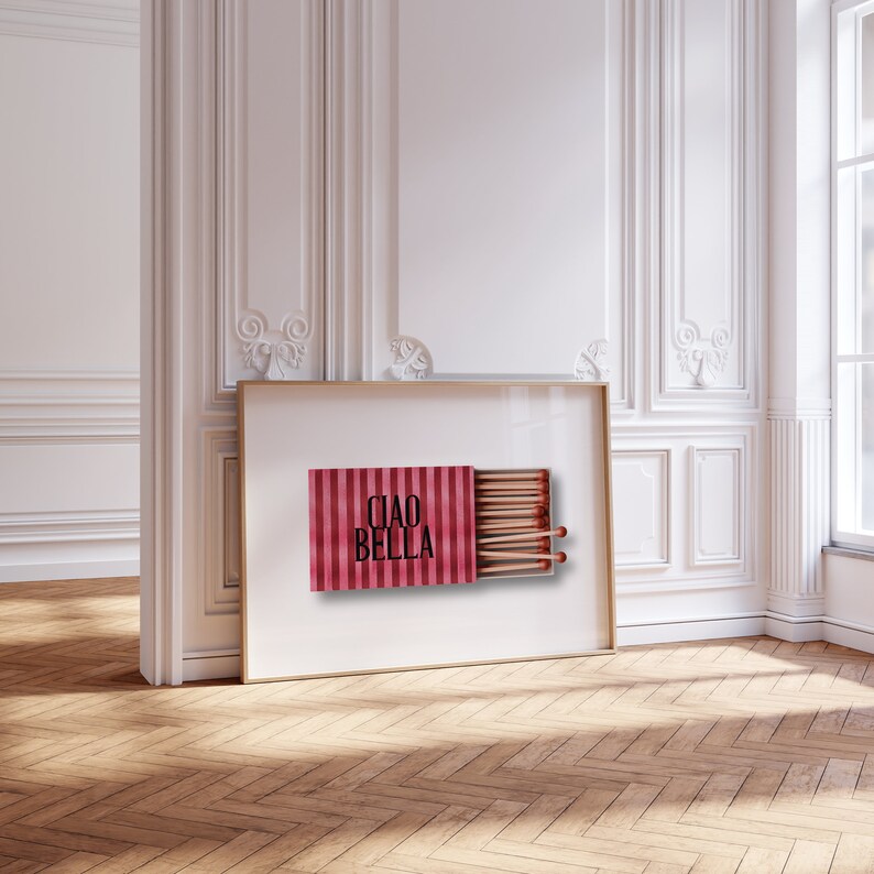 May include: A red and white striped matchbox with the text "CIAO BELLA" printed on the front. The matchbox is open and contains a row of matches.