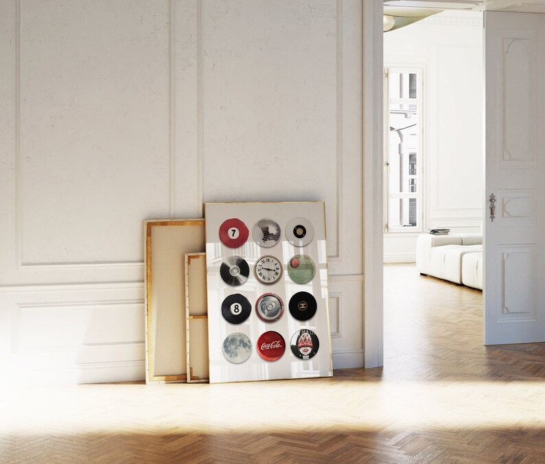 May include: A framed print with a white background and 16 circular images. The images include a clock, a Coca-Cola logo, a Chanel logo, a billiard ball, and a moon.