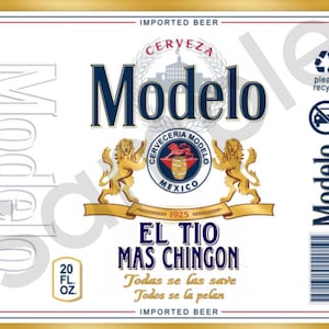 May include: A white beer label with a gold border. The label features the text "Modelo" in a large, bold font. Below the text is a smaller image of a lion holding a barrel. The text "El Tio Mas Chingon" is printed below the lion image. The text "Todas se las save Todos se la pelan" is printed below the text "El Tio Mas Chingon". The label also includes the text "Imported Beer" and "20 FL. OZ."