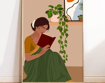 May include: A woman in a green and gold sari sits reading a red book. She is surrounded by plants in a room with a window.