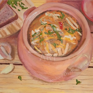 May include: A close-up of a bowl of soup with a red ladle and a piece of bread on a wooden table. The soup is a light yellow color and has green herbs and a red pepper in it. The bowl is a terracotta color and has a white rim. The bread is a light brown color and has a green herb on top. The table is a light brown color and has a wood grain pattern.