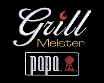 May include: White embroidered text on a black background that reads "Grill Meister papa."  A red grill icon is next to the word "papa."