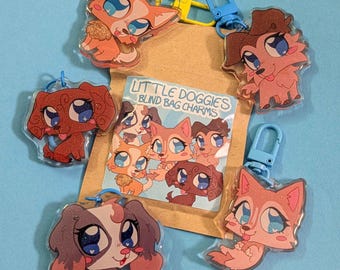 May include: A collection of Little Doggies blind bag charms featuring cartoon dog illustrations. The charms are clear acrylic with glitter accents and attached to keychains. The packaging reads "Little Doggies Blind Bag Charms". The background is a light blue.