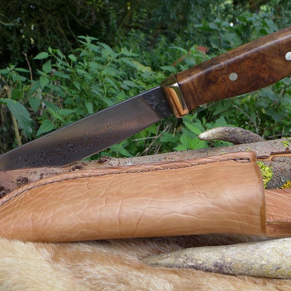 Hunting knife made from 300 layers of damask in medieval style.