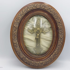 Antique Crucifix in Oval Dome Glass Frame - brass cross white gold fabric ornate wood cutting detailed flower pattern christus wall deco