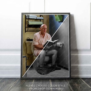 May include: A black and white photograph of a man sitting on a toilet reading a book. The photograph is split in half, with the top half in colour and the bottom half in black and white.