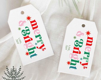 Peut inclure: Deux étiquettes cadeaux blanches avec les mots "merry & bright" en rouge, rose, vert et bleu. Les étiquettes ont un trou en haut et le texte "Love, Jeff" en bas. Thème de vacances festif.
