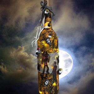 Halloween  lighted wine bottle featuring scary characters, Halloween  bottle art, scary lit decorated wine bottles, Etsy, Halloween decor