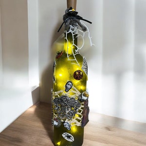 Halloween  lighted wine bottle featuring scary characters, Halloween  bottle art, scary lit decorated wine bottles, Etsy, Halloween decor