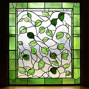 May include: Stained glass window panel with a design of green leaves and vines. The leaves vary in shades of green, with darker green accents. The border is a solid green with a textured appearance. The background is a frosted glass.