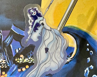 May include: A clear sticker featuring a cartoon illustration of a bride with long purple hair and a white wedding dress. The bride is in a dancing pose with one arm raised above her head.