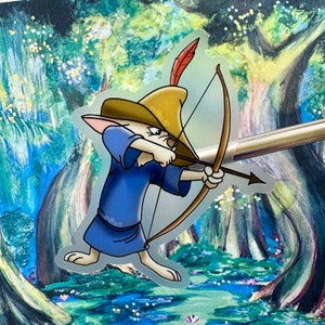 May include: A cartoon sticker of a fox dressed as Robin Hood, wearing a green tunic, brown hat with a feather, and holding a bow and arrow. The sticker is set against a painted background of a forest.