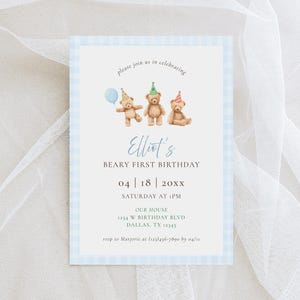 May include: A light blue and white gingham-bordered invitation card. The card features three teddy bears wearing party hats and holding a balloon. Text includes "Elliot's Beary First Birthday" and event details.