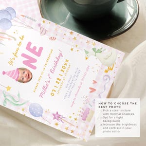 May include: A pink and white birthday invitation with the word "ONE" in large letters. The invitation includes a photo of a baby, balloons, and other festive illustrations. The text reads "Millie's 1st Birthday!"