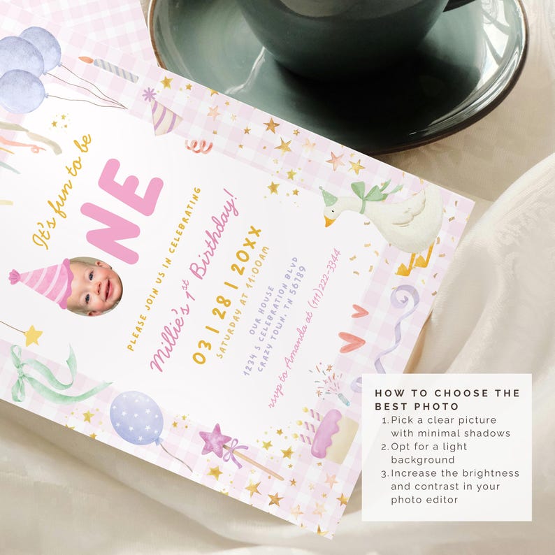 May include: A pink and white birthday invitation with the word "ONE" in large letters. The invitation includes a photo of a baby, balloons, and other festive illustrations. The text reads "Millie's 1st Birthday!"